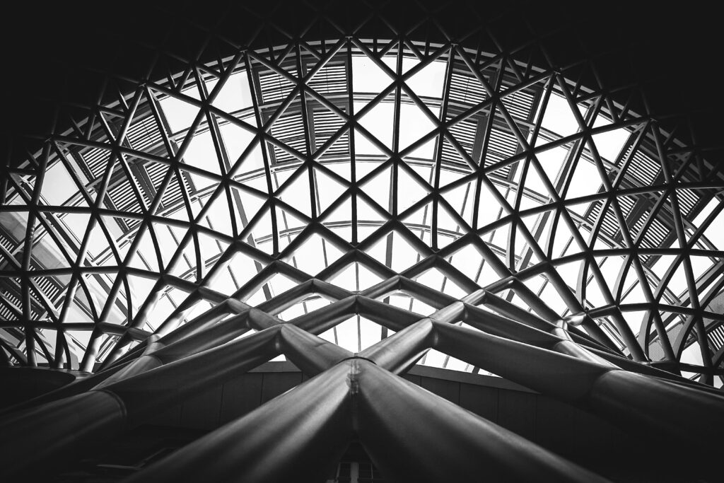 pexels-photo-175771-175771 A striking black and white photo of a modern steel dome with geometric patterns.